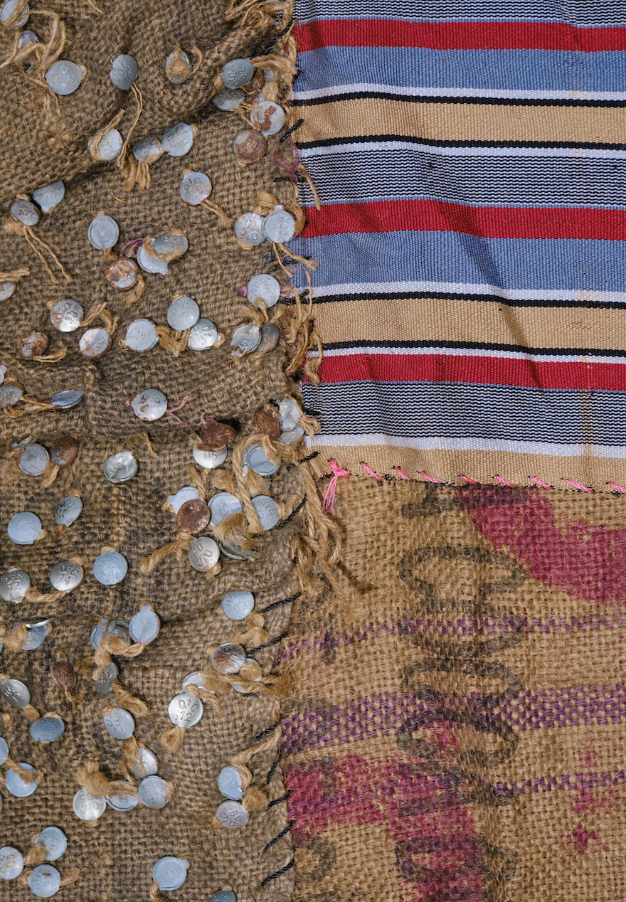 Detail of work: jute sack, fabric and coins