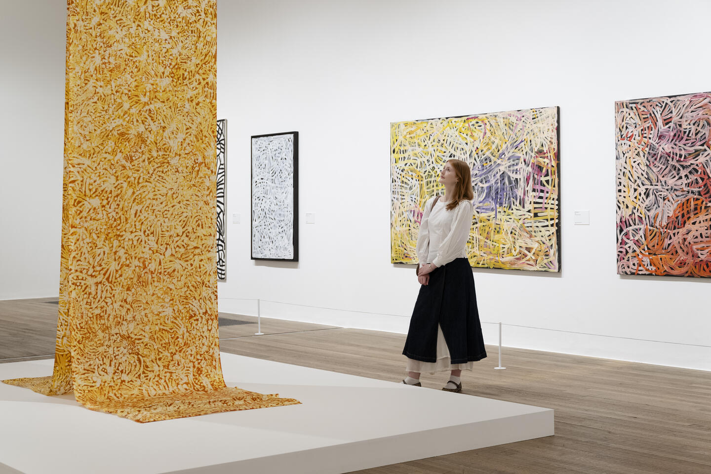 ‘Emily Kam Kngwarray’, installation view at Tate Modern 2025. © Emily Kam Kngwarray/Copyright Agency. Licensed by DACS 2025. Photo © Tate (Kathleen Arundell)