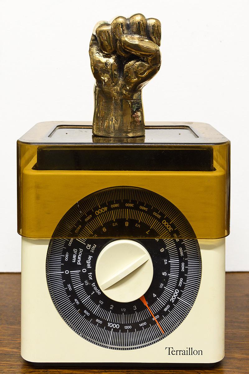 Azikiwe Mohammed Approximate Weight Of My Hair From Birth To Age 35, 2020 bronze and kitchen scale, 29.2 x 17.8 x 11.4 cm. Courtesy the artists and David Kordansky, Los Angeles 