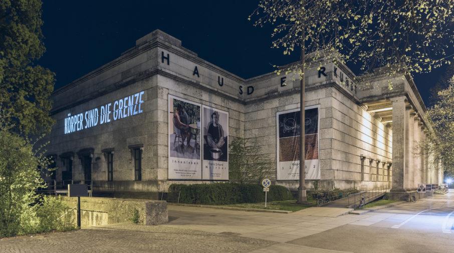 German text illuminated on wall of Haus der Kunst