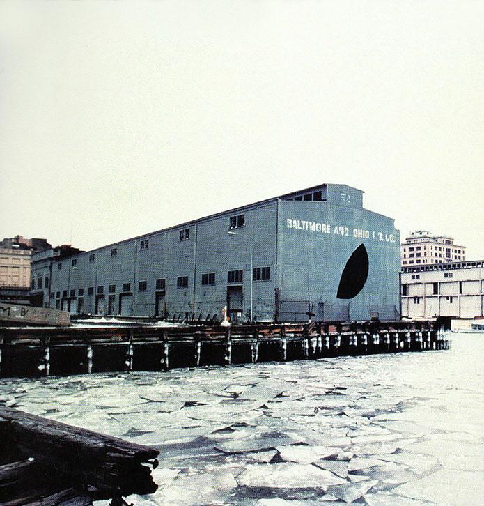 Gordon Matta-Clark, (1943-1978). Day’s End (Pier 52) (Exterior with Ice), 1975. Color photograph, 1029 x 794 mm.  © Estate of Gordon Matta-Clark, Artists Rights Society (ARS), N.Y.