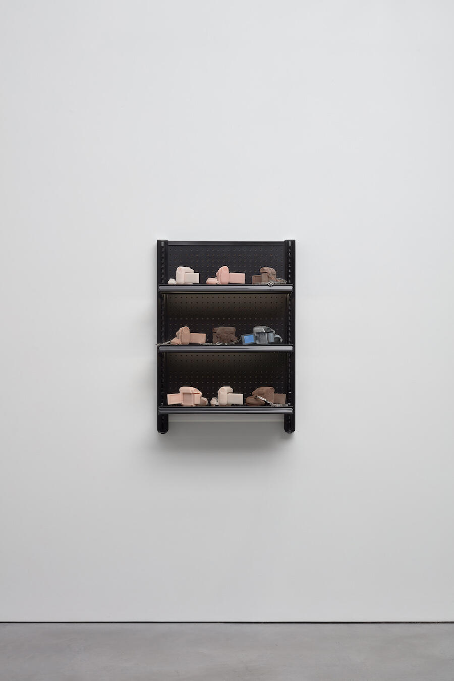 Josh Kline, Stories, 2016, cast silicone, handcuffs, 3D-printed sculpture in plaster, ink-jet ink, cyanoacrylate, commercial shelving with LEDs, 94 x 69.8 x 38.1 cm, 37 x 27 1/2 x 15 in, edition 3 of 3, 2 APs, courtesy the Artist and Modern Art