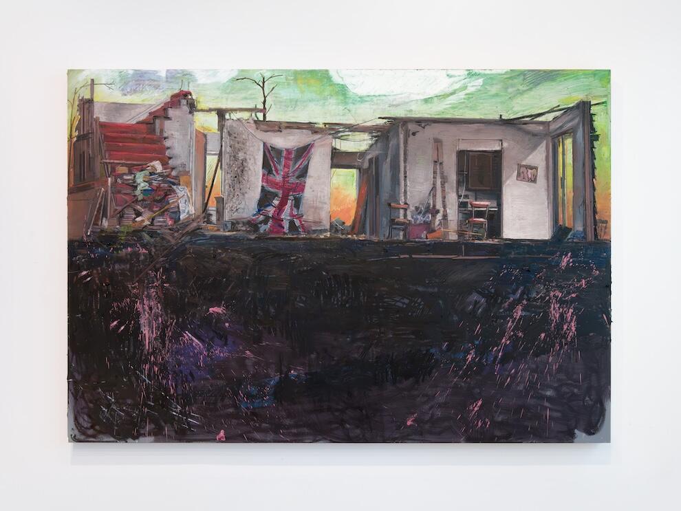 Image of ramshackle structure with a Union Jack flag hanging outside