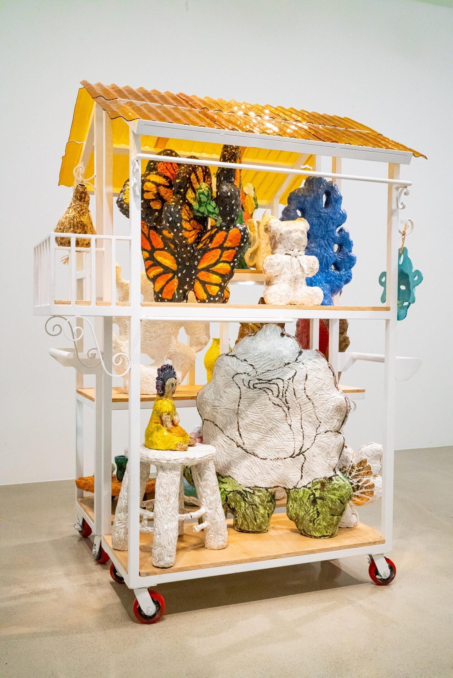 Anabel Juárez,&nbsp;Recuerdos, 2022. Glazed ceramic, metal cart, dimensions variable. Installation view from ‘Recordar Es Vivir’, Carolyn Campagna Kleefeld Contemporary Art Museum, California State University, Long Beach. Courtesy: the artist and Anat Ebgi, Los Angeles / New York. Photograph: Tatiana Mata