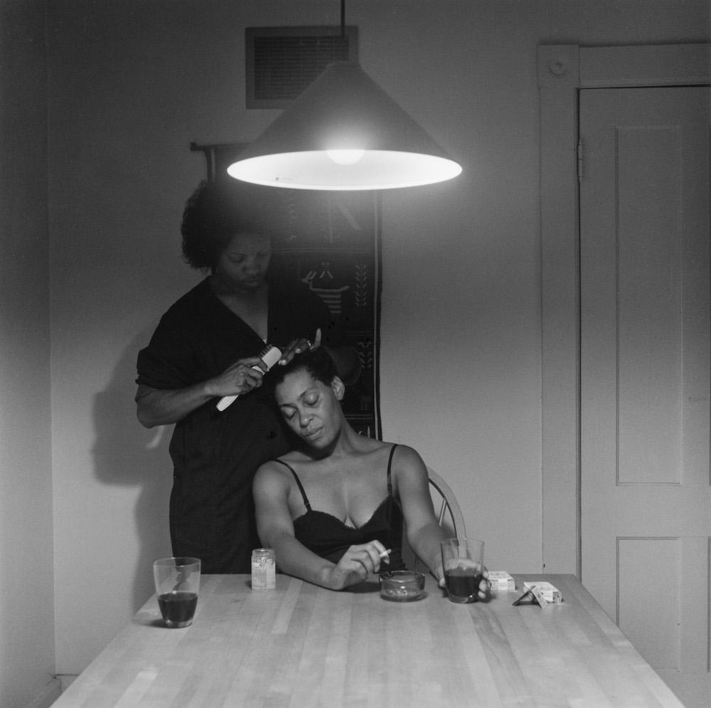 Carrie Mae Weems, Untitled (Woman brushing hair), 1990, silver print, 72 × 72 cm. Courtesy: © Carrie Mae Weems and Jack Shainman Gallery, New York