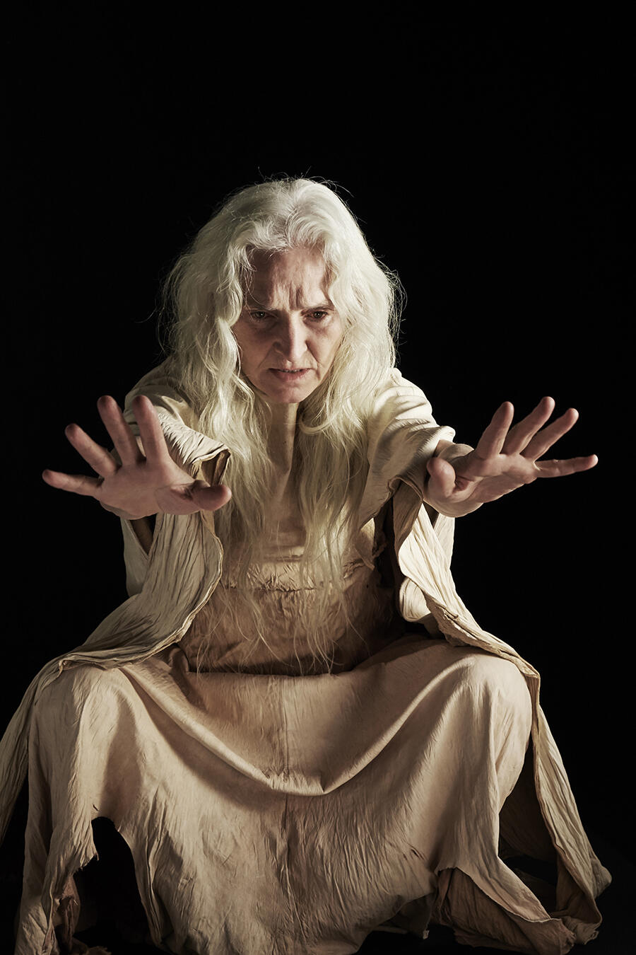 witch-woman-in-white-hands-outstretched