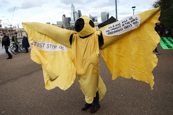 A protester takes part in a demonstration by Extinction Rebellion outside Tate Modern.