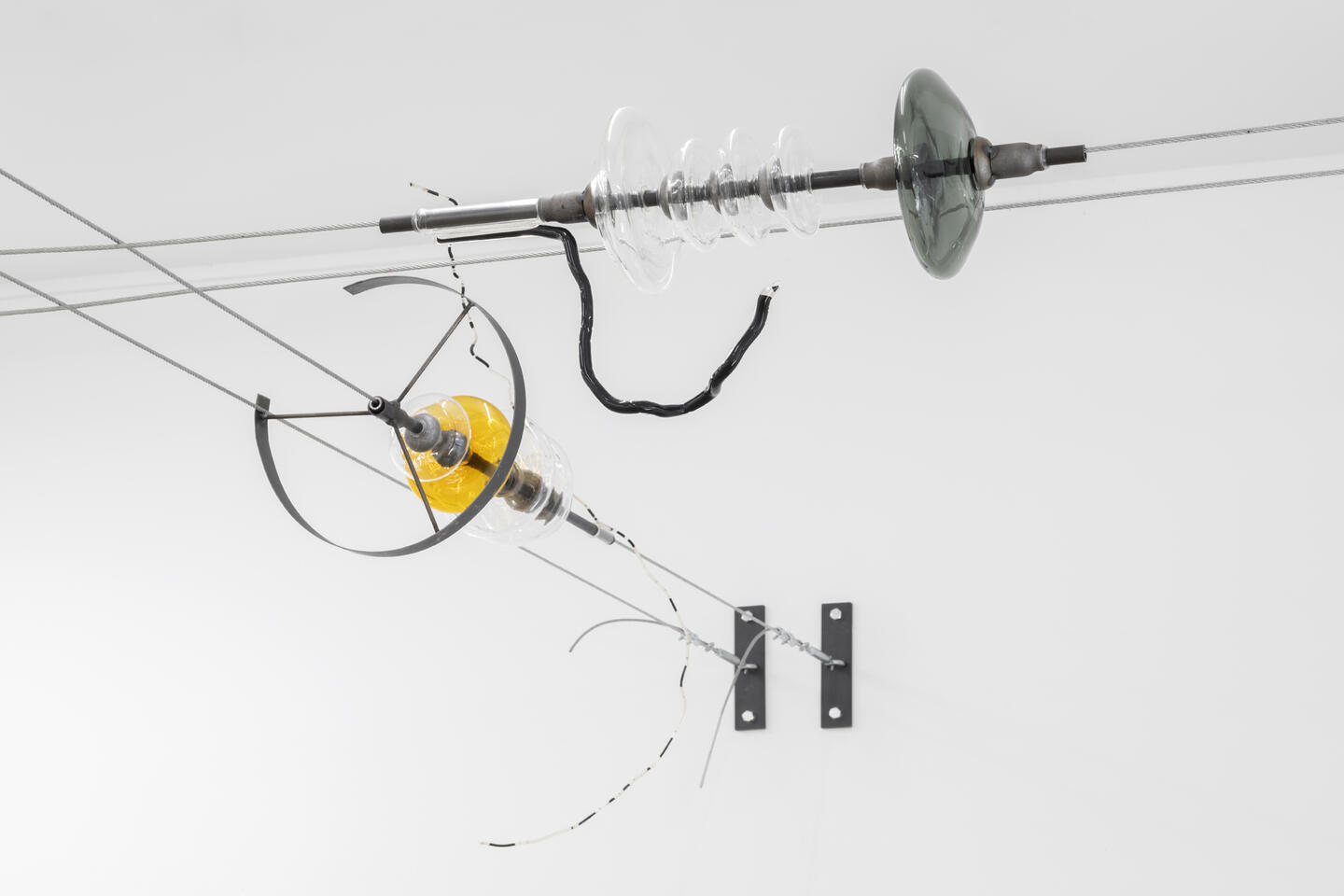 Lara Fluxà, Saarc, 2024, and Lemms, 2024. Glass, iron and motor oil. Courtesy: the artist and Bombon