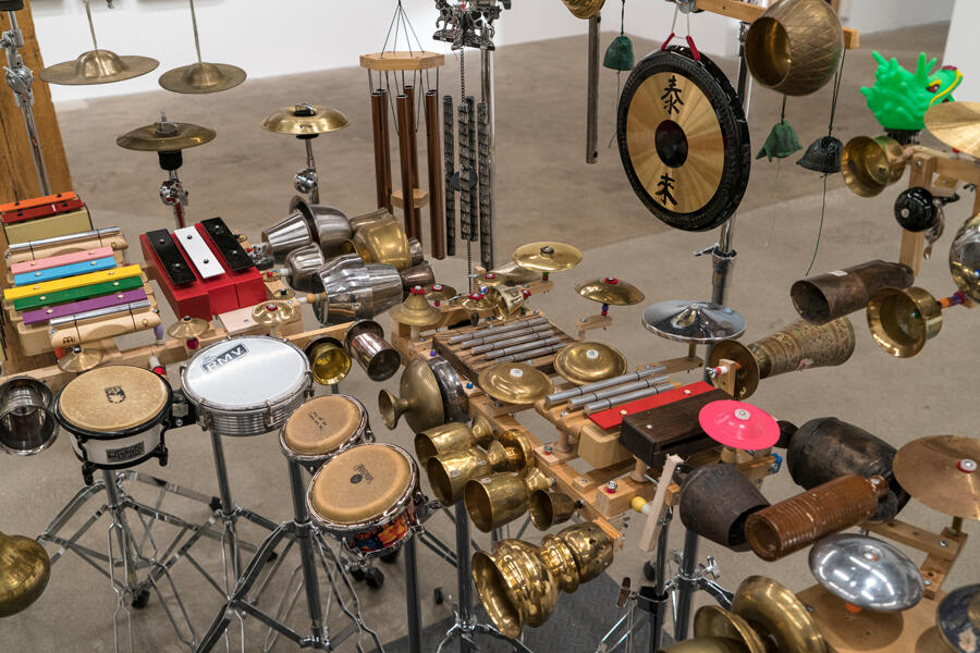 A panoply of instruments -- drums, gongs, xylophones -- installed in a gallery